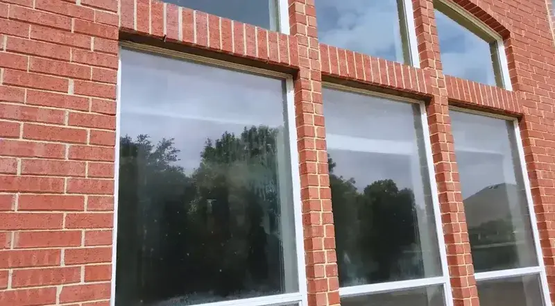 Cloudiness visible in window glass