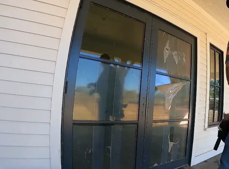 Protective film, labels, and installation residue left on new glass doors