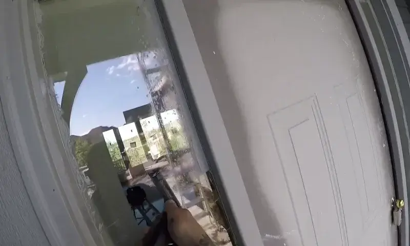 Technician cleaning construction residue from a newly installed window