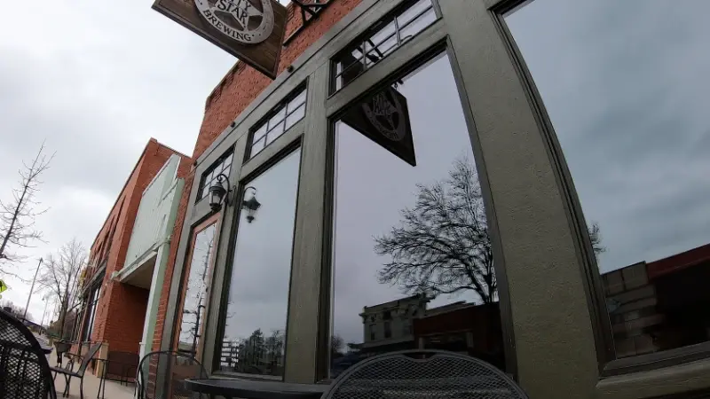 Tall commercial windows at a local restaurant and brewery