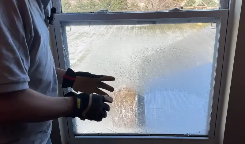 Regular window cleaning on glass affected by hard water spots